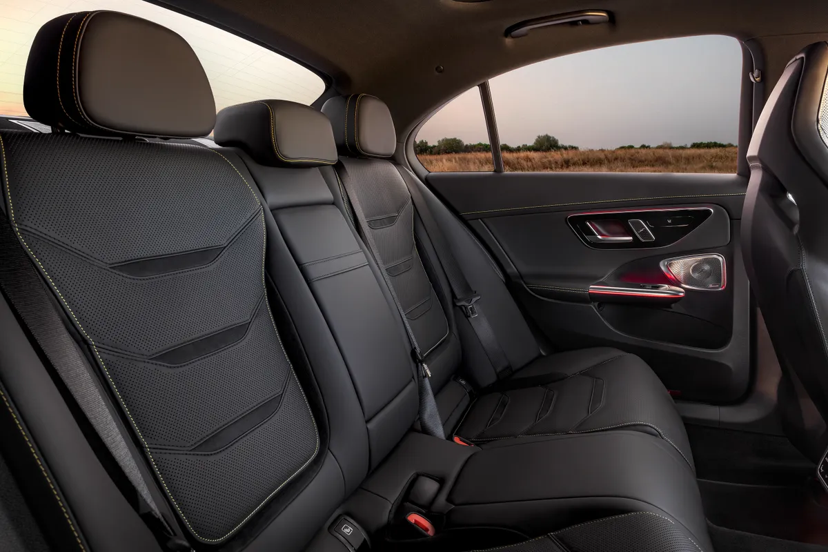 A car with black leather seats and a window.