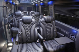 A black and white bus with many seats